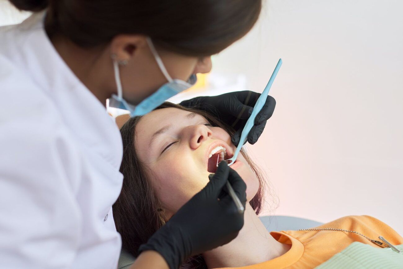 Young woman receiving a dental cleaning in The Woodlands