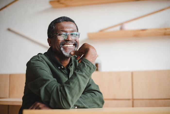 A smiling man with glasses