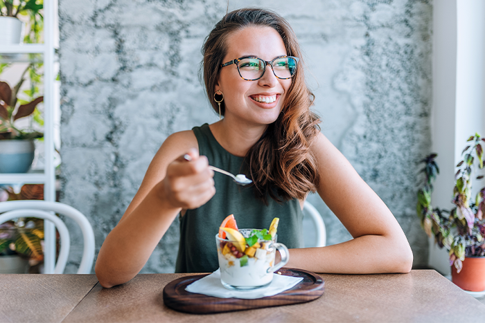 A woman eating breakfast