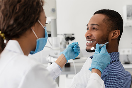 Don’t skip your regular dental check-ups even if you have no remaining natural teeth