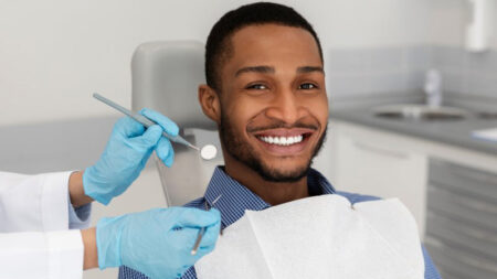 Man smiling after his cosmetic dental treatment