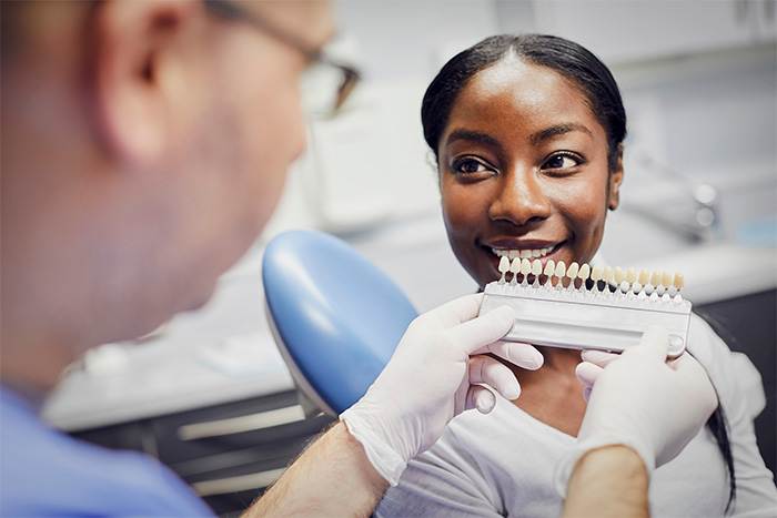 The Woodlands patient smiling after teeth whitening