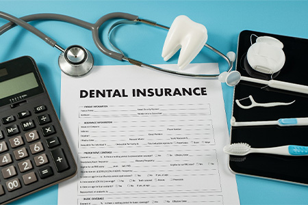 Patient in The Woodlands reviewing dental insurance benefits.